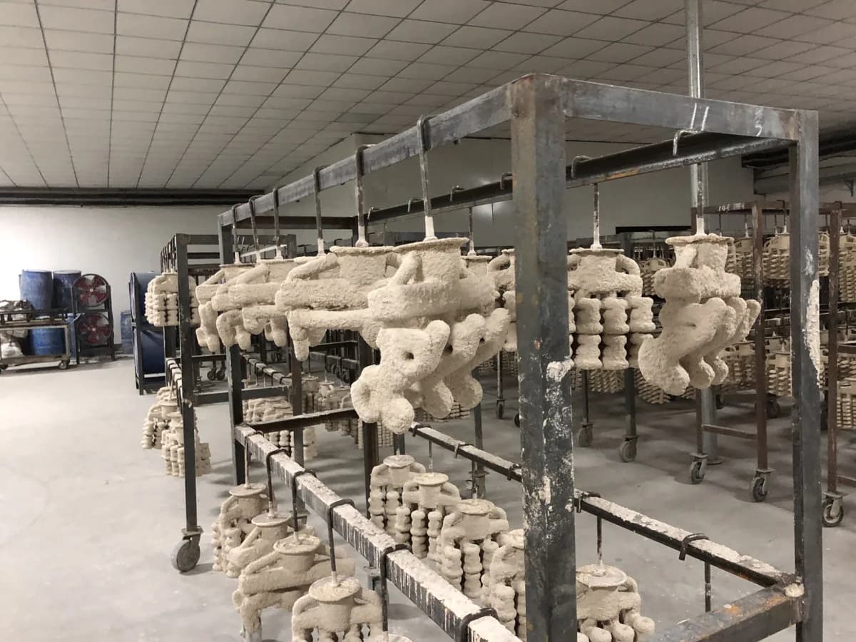 Ceramic shell molds hanging on drying racks