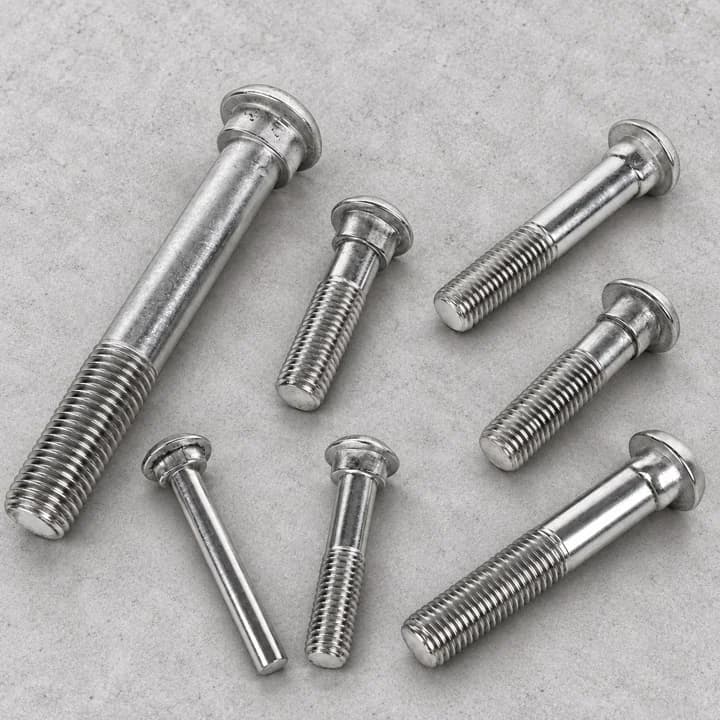 Flanged Threaded Pins on a textured concrete background