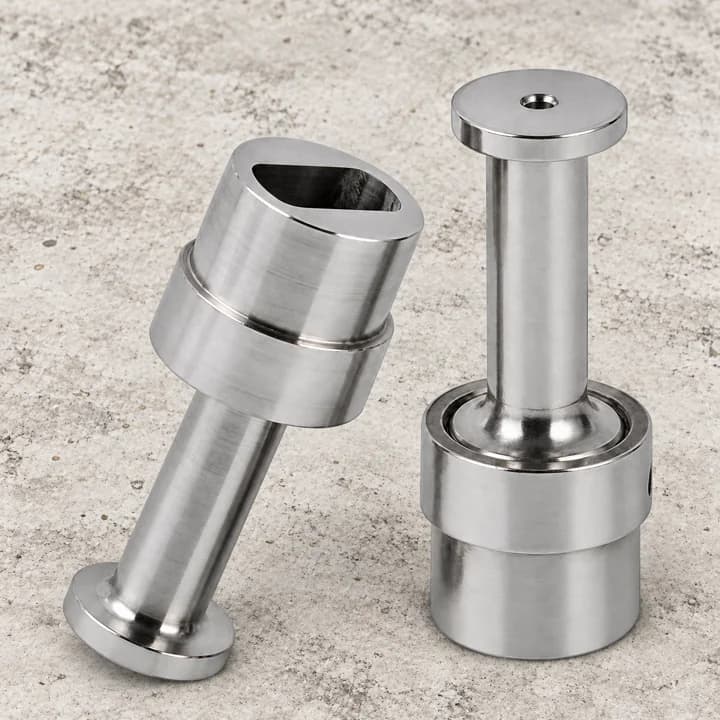 Stepped Shaft Components on a textured concrete background