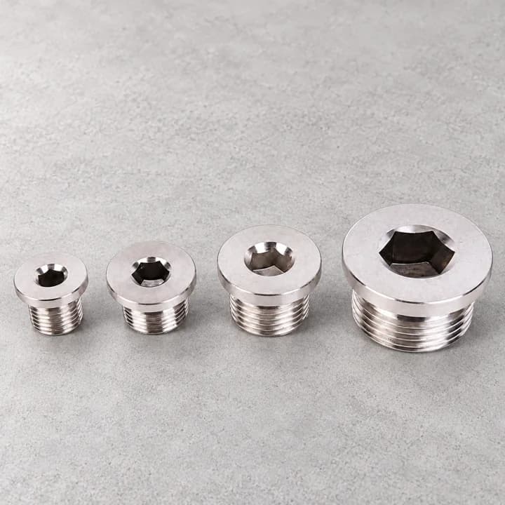 Recessed Threaded Plugs on a textured concrete background