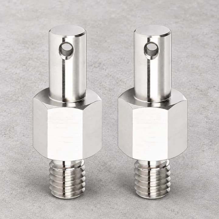 Slotted Threaded Studs on a textured concrete background
