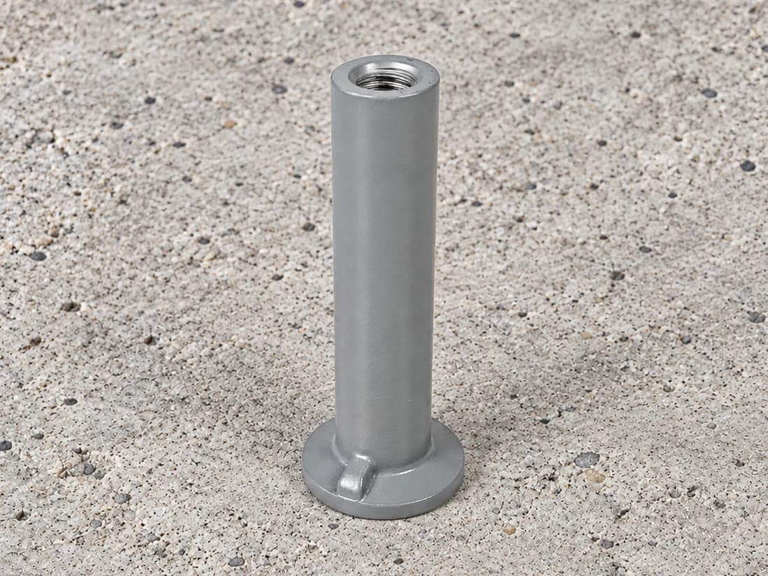 Grey-appearing cylindrical threaded insert with a circular flange and local base ribs