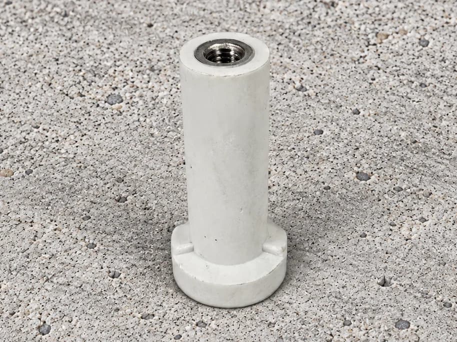Light-coloured round-foot ferrule with a visible internal thread and shaped base details